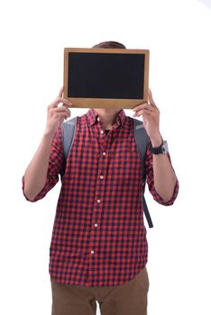 Asian male student covering his face with a chalkboard