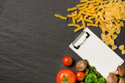 Italian spaghetti photo recipe. Stationary mockup on the kitchen table surrounded with products.