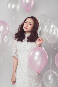 Asian beauty fashion woman with pastel balloons