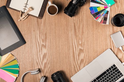 Top view of photographer at workplace with copy space