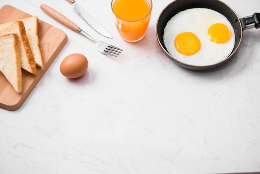 Traditional breakfast with fried eggs on a plate