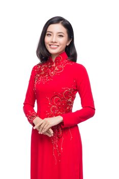 Charming Vietnamese Woman in Ao Dai Traditional Dress isolated on white.