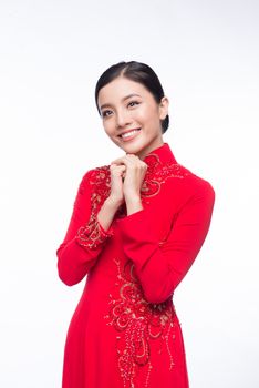 Charming Vietnamese Woman in Ao Dai Traditional Dress, Gesture to Pray or Wishing.