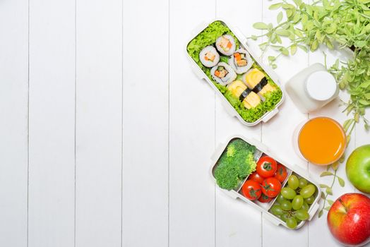 Bento box with different food, fresh veggies and fruits