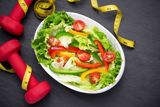 Healthy fitness meal with fresh salad. Diet concept.