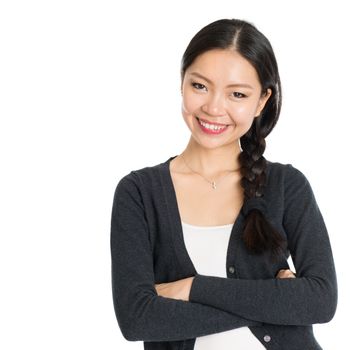 Portrait of young Asian female with braid hair, arms crossed and smiling, isolated on white background.
