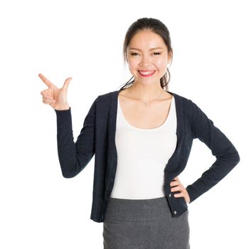 Portrait of young Asian girl finger pointing something and smiling, isolated on white background.