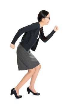 Full length portrait of young Asian female running, isolated on white background.