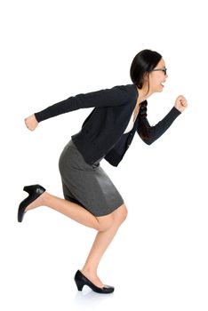 Full length portrait of young Asian woman running, isolated on white background.