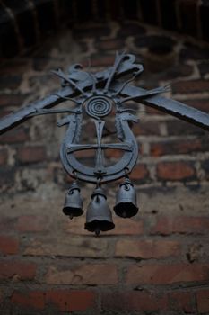 Old black wrought iron bells in old Lubart castle Lutsk Ukraine