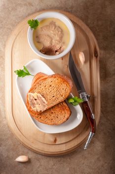 Home made chicken liver pate on a wooden surface