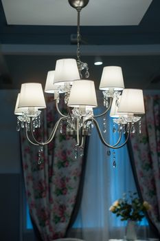 decorative designer chandelier on a dark background.