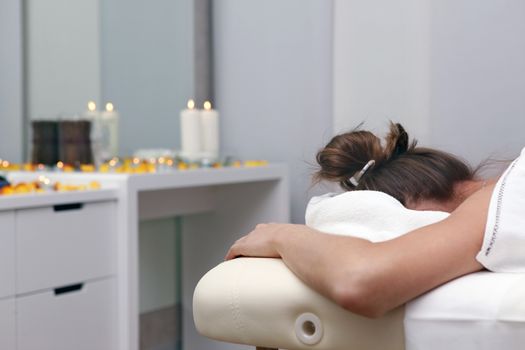 White woman on massage in spa salon