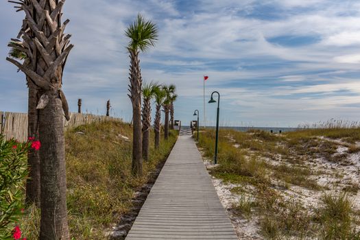 A boardwalk leads to a beach at the Gulf of Mexico at Destin, Florida.