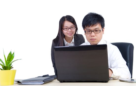 Business man and woman working together with laptop