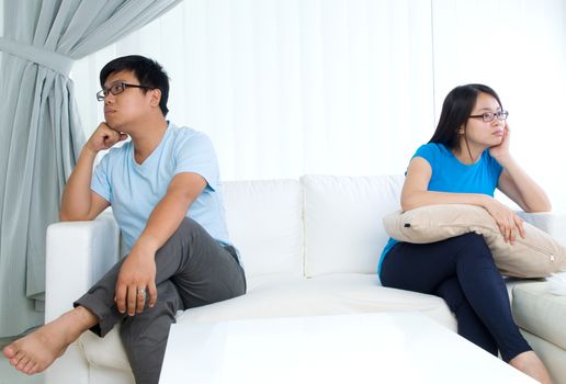 Asian young Couple having argument in the living room