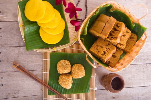 Ma Lai Gou-Traditional malaysia steamed cake.Malaysia desert ,Onde-Onde or known as Chinese Sesame Ball on banana leaf. Steam chinese cake on bamboo plate.