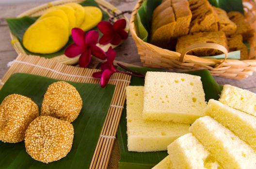 Ma Lai Gou-Traditional malaysia steamed cake.Malaysia desert ,Onde-Onde or known as Chinese Sesame Ball on banana leaf. Steam chinese cake on bamboo plate. Chinese egg cake on banana leaf.