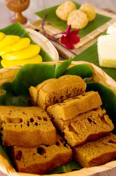 Ma Lai Gou-Traditional malaysia steamed cake.Malaysia desert ,Onde-Onde or known as Chinese Sesame Ball on banana leaf. Steam chinese cake on bamboo plate. Chinese egg cake on banana leaf.