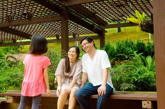 Happy Asian Family enjoying their time in the park