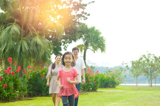 Happy Asian Family enjoying their time in the park