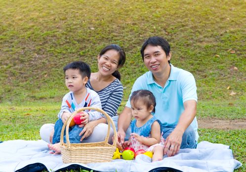 Outdoor portrait of asian family