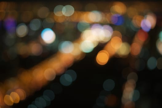 Defocused of glitter or bokeh circle on expressway at night as background.