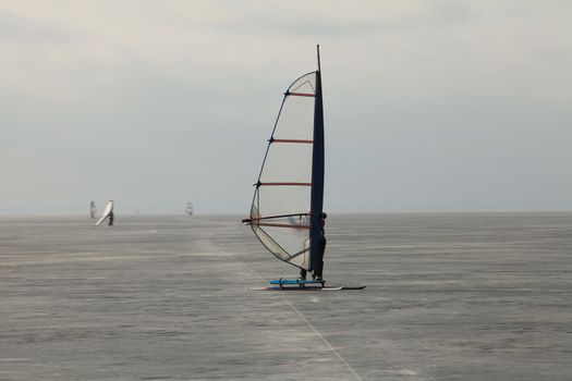 windsurfer Ice surfing  Extreme winter sport Finnish Gulf near St. Petersburg