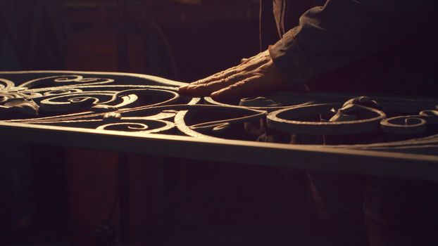 Close up of forging metal grate in smithy