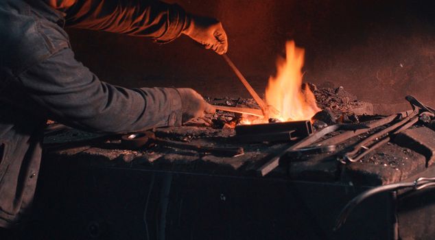 Close up of heating of metal detail in the fire