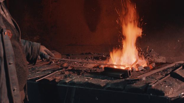 Close up of heating of metal detail in the fire