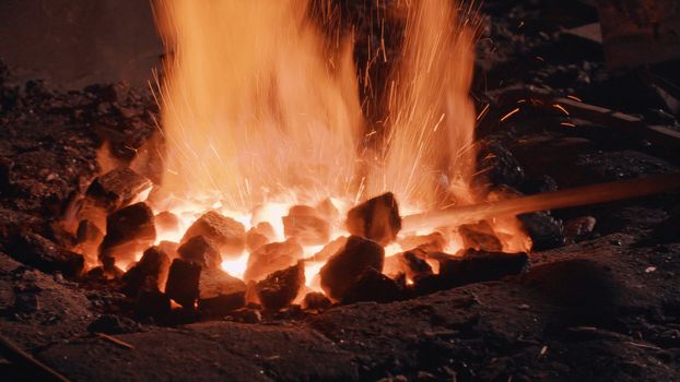 Close up of heating of metal detail in the fire