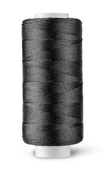 Black thread on the coil vertically isolated on white background