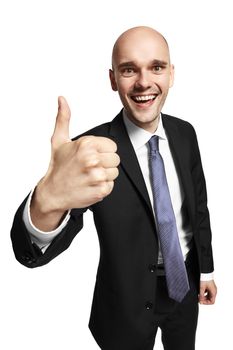 Studio shot of happy young businessman shows his thumb. Isolated on white background.