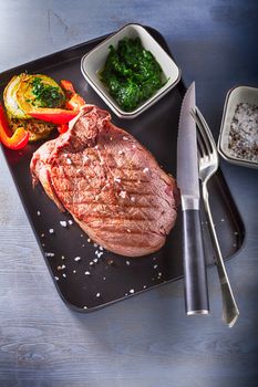 Roast Beef dinner with roasted zucchini, pepper and salsa verde