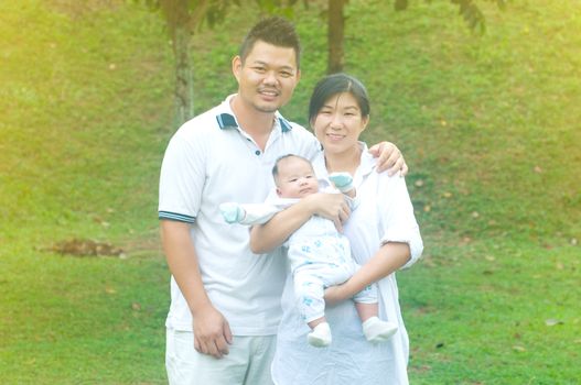 happy asian young family spending time outdoor on a summer day