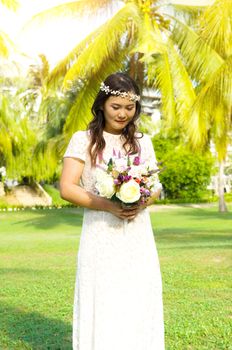 Asian bride at outdoor in a morning