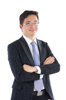 Confident Southeast Asian businessman crossed arms over white background