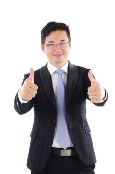 Excited thumb up 30s Asian businessman in black suit isolated on white background