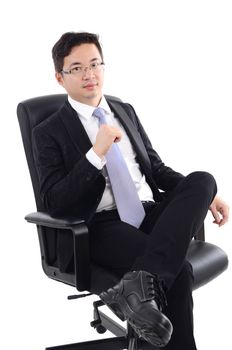 Asian business man seated on chair, isolated on white background.