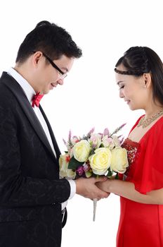 Attractive Bride and Groom at Wedding with flower over a white background