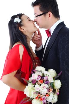 Attractive Bride and Groom at Wedding with flower over a white background