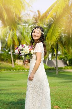 Asian bride at outdoor in a morning