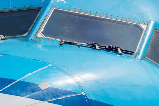 Cockpit close up of blue jet airplane