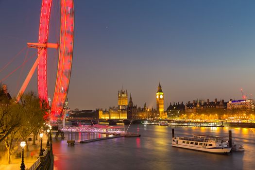 Night photo of London Eye, Big Ben and Palace of Westminster aka Houses of parliament in London, UK.