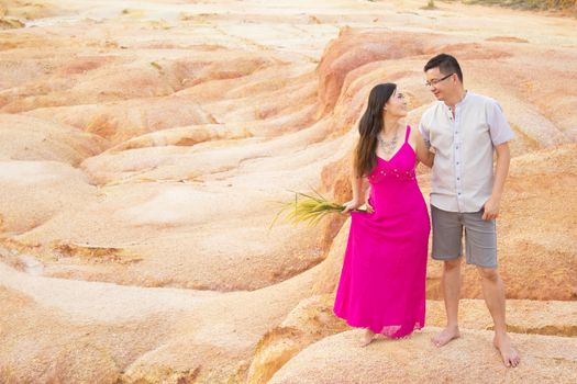 Asian couple hugging with canyon background. Valentine's day concept