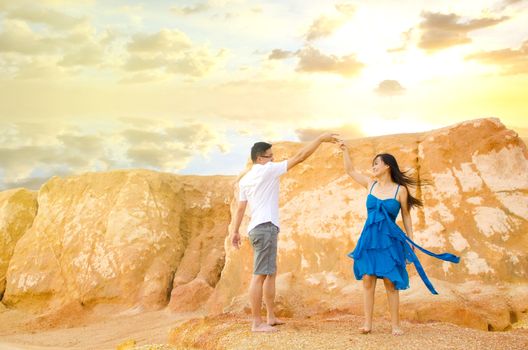 Asian couple with canyon background. Valentine's day concept