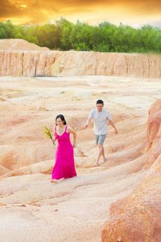 Asian couple hugging with canyon background. Valentine's day concept