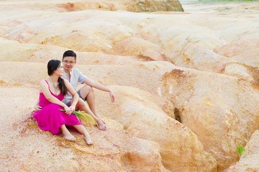 Asian couple hugging with canyon background. Valentine's day concept