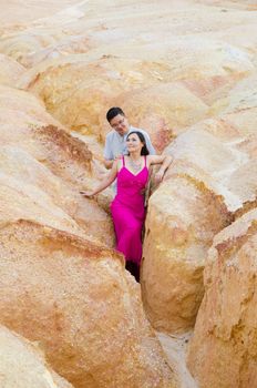 Asian couple hugging with canyon background. Valentine's day concept